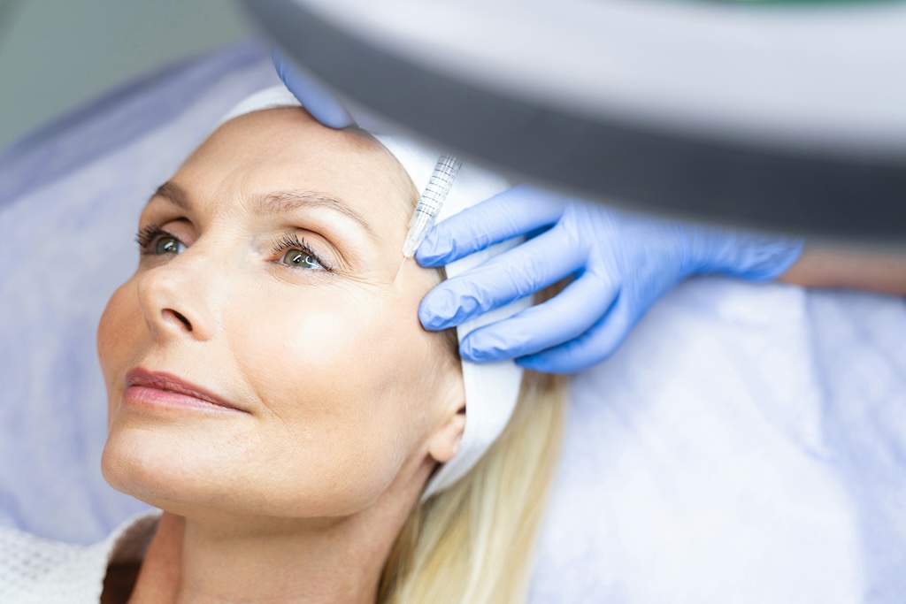 A physician administers Botox to treat a patient's crow's feet in Rockville.